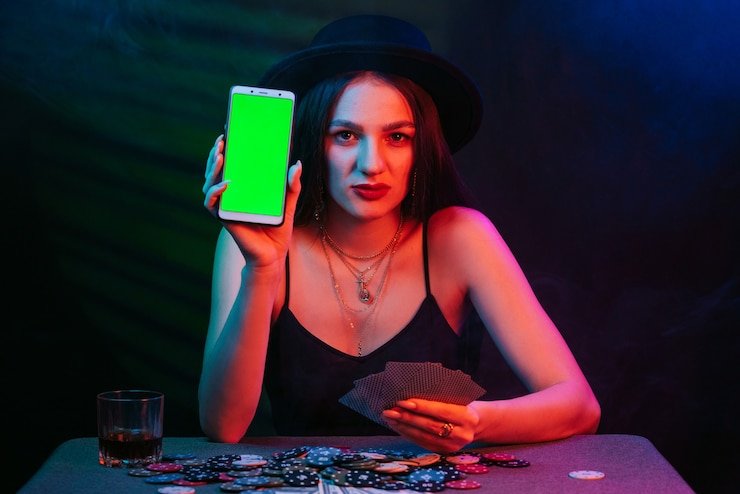 Live dealer seated at Texas Hold'em Bonus table, multiple camera angle screen